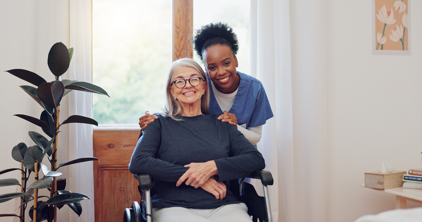 Caregiver with elderly client in wheelchair